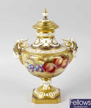 A good Royal Worcester porcelain fruit-painted vase and cover by Leaman