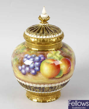 A large Royal Worcester porcelain fruit-painted pot pourri vase and cover by Leaman