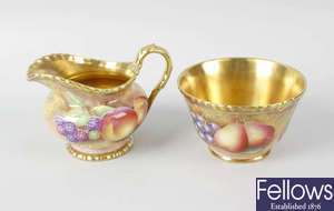 A Royal Worcester porcelain fruit-painted milk jug and sugar bowl by Leaman