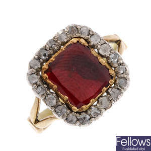 An early 19th century gold, foil back garnet and diamond cluster ring.