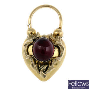 A late Victorian gold and garnet cabochon memorial clasp.