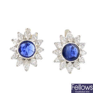 A pair of Burma sapphire and diamond cluster earrings.
