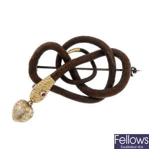 An early to mid Victorian memorial snake gold hair brooch.