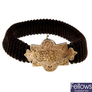 A mid Victorian memorial hair bracelet with 15ct gold clasp.