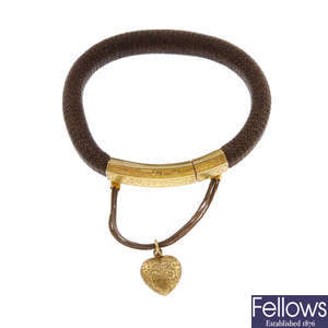 An early to mid Victorian memorial hair bangle with 18ct gold clasp.