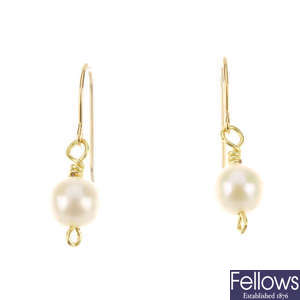 A pair of cultured pearl drop earrings.