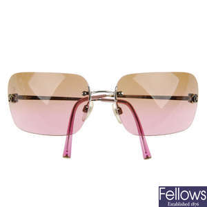 CHANEL - a pair of rimless sunglasses