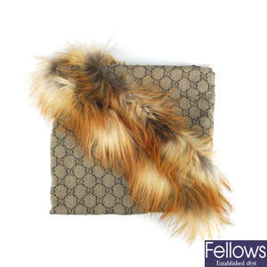 GUCCI - a fox fur trim scarf.
