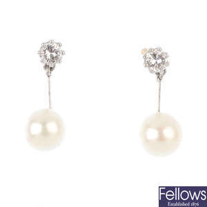 A pair of diamond and cultured pearl earrings.