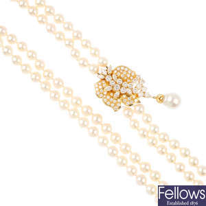 MIKIMOTO - a cultured pearl two-row necklace, with 18ct gold diamond clasp.