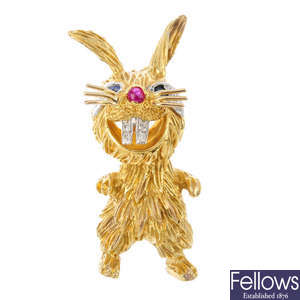 KUTCHINSKY - an 18ct gold diamond and gem-set rabbit brooch.