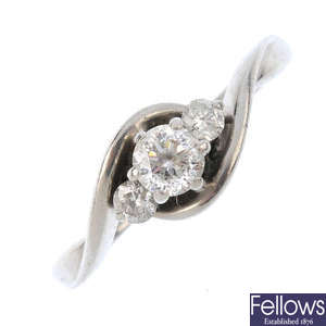A palladium diamond three-stone crossover ring.