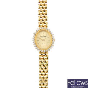 A lady's 18ct gold diamond watch.