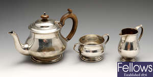An early twentieth century composite silver three piece tea service.