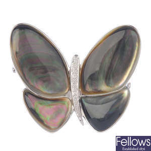 A mother-of-pearl and diamond butterfly pendant.