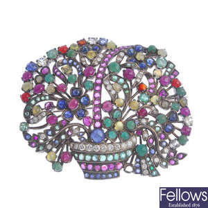 A diamond and gem-set floral basket brooch.