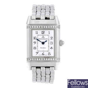 JAEGER-LECOULTRE - a lady's factory diamond set stainless steel Reverso bracelet watch.