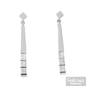 A pair of 18ct diamond earrings.