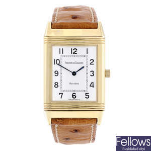 JAEGER-LECOULTRE - a lady's 18ct yellow gold Reverso wrist watch.