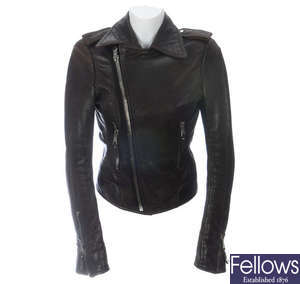 BALENCIAGA - a brown leather biker jacket.