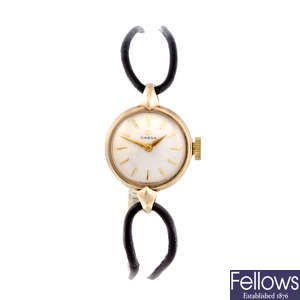 OMEGA - a lady's 9ct yellow gold wrist watch.