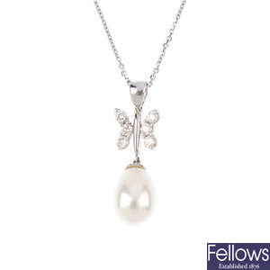 An 18ct gold diamond and cultured pearl butterfly pendant, with chain.