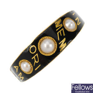 A late Victorian gold enamel and split pearl memoriam ring.
