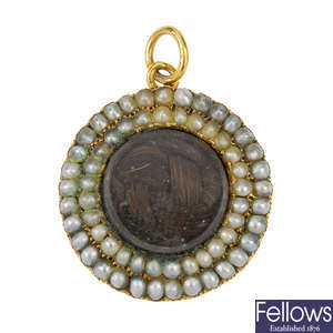 A mid Victorian gold and split pearl memorial pendant.