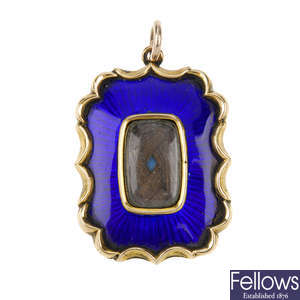 A late Victorian gold and enamel memorial pendant.