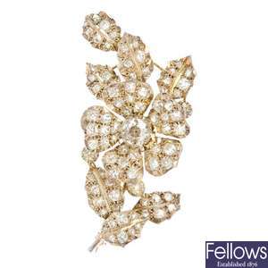 A diamond 'en tremblant' floral brooch.