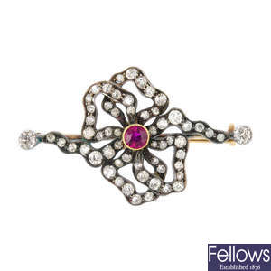 An early 20th century silver and gold diamond and ruby brooch.