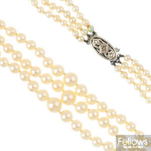 A cultured pearl three-row necklace, with diamond push-piece clasp.