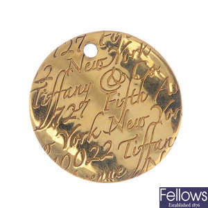 TIFFANY & CO. - an 18ct gold 'Notes' pendant.