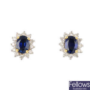 A pair of sapphire and diamond cluster earrings.