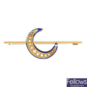 A diamond and enamel crescent brooch.