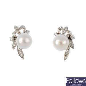 A pair of diamond and pearl earrings.