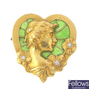 An Art Nouveau gold plique-a-jour enamel and diamond brooch.
