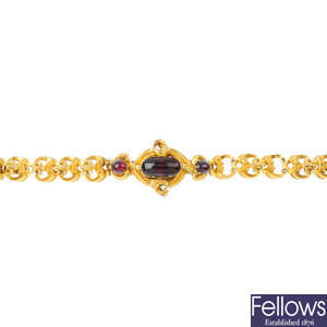A mid Victorian gold garnet bracelet.