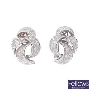 A pair of diamond earrings. 