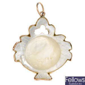 A Chinese mother of pearl pendant.