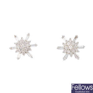 A pair of diamond cluster stud earrings.