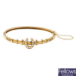 A late Victorian 9ct gold split pearl hinged bangle.