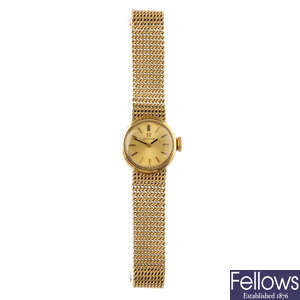 OMEGA - a lady's 9ct gold wrist watch.