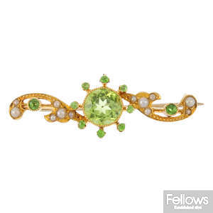 An early 20th century 15ct gold peridot, garnet and split pearl brooch.