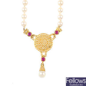 A diamond, ruby and cultured pearl necklace.