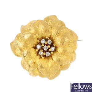 A diamond flower brooch.