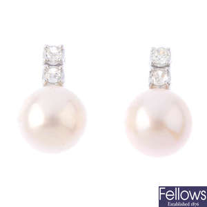 A pair of cultured pearl and diamond earrings.