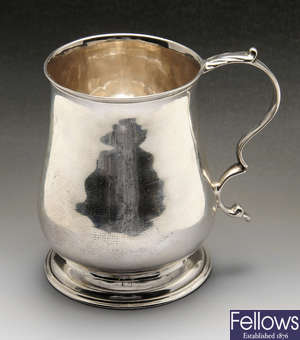 A George III silver christening mug.