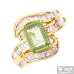 A peridot and diamond dress ring.