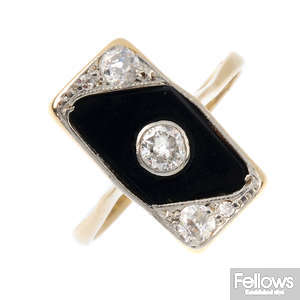 An Art Deco 18ct gold and platinum diamond and onyx ring.